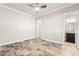 Unfurnished bedroom with ceiling fan, and access to bathroom and closet at 3914 Jacob Lake Cir, Las Vegas, NV 89118