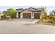Beautiful single-story home featuring a well-manicured front yard, and a convenient two-car garage at 3914 Jacob Lake Cir, Las Vegas, NV 89118