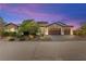 Charming single-story home featuring a well-manicured front yard and a three-car garage at 3914 Jacob Lake Cir, Las Vegas, NV 89118