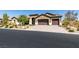 A well-maintained single-story home with desert landscaping, a three-car garage, and a 'For Sale' sign at 3914 Jacob Lake Cir, Las Vegas, NV 89118