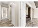 Hallway with multiple doors, archways, and a stone floor at 3914 Jacob Lake Cir, Las Vegas, NV 89118