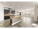 Open kitchen showcasing a large island, tile backsplash, modern appliances, and ample cabinet space at 3914 Jacob Lake Cir, Las Vegas, NV 89118
