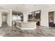 Well-appointed kitchen with a generous island, stainless steel refrigerator, and sleek, dark cabinetry at 3914 Jacob Lake Cir, Las Vegas, NV 89118
