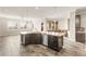 Open kitchen layout features a large island with seating, stainless steel appliances, and an adjacent cozy nook at 3914 Jacob Lake Cir, Las Vegas, NV 89118