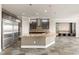 Spacious kitchen boasts a large island, stainless steel appliances, and views into the connected living area at 3914 Jacob Lake Cir, Las Vegas, NV 89118