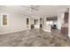 Open living room with stone floors, a ceiling fan, and a seating nook at 3914 Jacob Lake Cir, Las Vegas, NV 89118