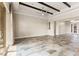 Expansive living area with tile flooring, exposed ceiling beams, and sliding doors to outdoor space at 3914 Jacob Lake Cir, Las Vegas, NV 89118