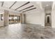 Large living room with a ceiling fan, backyard view and a tiled floor at 3914 Jacob Lake Cir, Las Vegas, NV 89118