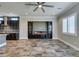 Open-concept living space with kitchen, fireplace, and bright windows enhancing the modern design at 3914 Jacob Lake Cir, Las Vegas, NV 89118