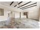 Bright living room featuring beamed ceilings, tile floors, and an open layout for modern living and entertaining at 3914 Jacob Lake Cir, Las Vegas, NV 89118