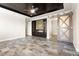 Empty main bedroom featuring a fireplace, media center, and tray ceiling at 3914 Jacob Lake Cir, Las Vegas, NV 89118