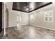 Spacious main bedroom with a tray ceiling, ceiling fan, and walk-in closets at 3914 Jacob Lake Cir, Las Vegas, NV 89118