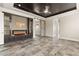 Spacious main bedroom featuring a fireplace, media center, and tray ceiling at 3914 Jacob Lake Cir, Las Vegas, NV 89118
