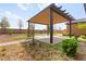 Outdoor pergola with manicured greenery at 3914 Jacob Lake Cir, Las Vegas, NV 89118