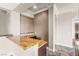 Convenient wet bar with elegant granite countertops and cabinetry, adjacent to the main living area at 3914 Jacob Lake Cir, Las Vegas, NV 89118