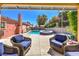 Inviting backyard showcases a pool, spa, lounge chairs, and a well-maintained landscape at 4095 Ridgewood Ave, Las Vegas, NV 89120