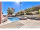 Serene backyard boasts a private pool, spa, and beautiful landscaping for ultimate relaxation at 4095 Ridgewood Ave, Las Vegas, NV 89120