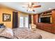 Comfortable bedroom features an abundance of storage with a custom entertainment center at 4095 Ridgewood Ave, Las Vegas, NV 89120
