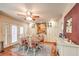 Bright and airy dining area featuring a ceiling fan and access to a large outdoor patio at 4095 Ridgewood Ave, Las Vegas, NV 89120
