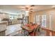 Open-plan kitchen and dining area with tiled flooring, recessed lighting, and a ceiling fan at 4095 Ridgewood Ave, Las Vegas, NV 89120
