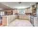 Modern kitchen with custom cabinets, stainless steel appliances, and a breakfast bar at 4095 Ridgewood Ave, Las Vegas, NV 89120
