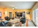 Bright living room with stylish furniture, a large TV, and access to the backyard at 4095 Ridgewood Ave, Las Vegas, NV 89120