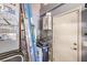 Functional utility area with water heater, water softener, and storage solutions at 4095 Ridgewood Ave, Las Vegas, NV 89120