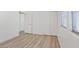 Bedroom with wood floors, natural light and sliding door closet at 4305 Morgan Manor St # 3, North Las Vegas, NV 89032