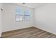 Bedroom with wood floors and two windows allowing natural light at 4305 Morgan Manor St # 3, North Las Vegas, NV 89032