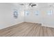 Bright bonus room with wood floors, a ceiling fan, and ample natural light at 4305 Morgan Manor St # 3, North Las Vegas, NV 89032