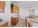 View of kitchen featuring white appliances, wood cabinets, and a stainless steel sink at 4305 Morgan Manor St # 3, North Las Vegas, NV 89032