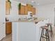 Bright kitchen features a breakfast bar and a gas range at 4305 Morgan Manor St # 3, North Las Vegas, NV 89032
