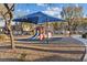 Community playground with slide and covered play area for outdoor fun and recreation at 4305 Morgan Manor St # 3, North Las Vegas, NV 89032