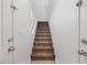A carpeted stairway leads to the upper levels of the home, with a white wall at 4305 Morgan Manor St # 3, North Las Vegas, NV 89032