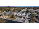 Expansive aerial view of a two-story home featuring solar panels, a three-car garage, and lush landscaping at 4880 Hayride St, Las Vegas, NV 89149