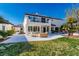 Expansive backyard with patio, grass, and balcony overlooking the well-maintained landscaping at 4880 Hayride St, Las Vegas, NV 89149