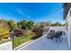 Balcony featuring an outdoor seating area and a beautiful view of the backyard and lush landscaping at 4880 Hayride St, Las Vegas, NV 89149