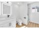 Modern bathroom with a backlit mirror, sleek vanity, and a glass-enclosed shower, offering a spa-like experience at 4880 Hayride St, Las Vegas, NV 89149