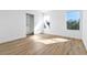 Well-lit bedroom shows wood-look floors, windows and a closet at 4880 Hayride St, Las Vegas, NV 89149