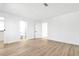 Bright and airy bedroom with modern flooring, white walls and doors leading to the bathroom and closet at 4880 Hayride St, Las Vegas, NV 89149