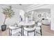 Cozy dining area with a round table, contemporary chairs, and seamless flow to living space at 4880 Hayride St, Las Vegas, NV 89149