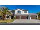 Desirable two-story home with a three-car garage, tile roof, and concrete driveway at 4880 Hayride St, Las Vegas, NV 89149
