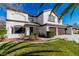Beautiful two-story stucco home with a well-manicured lawn and three-car garage at 4880 Hayride St, Las Vegas, NV 89149