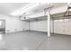 Spacious garage with ample room, overhead storage, and a clean, epoxy-coated floor at 4880 Hayride St, Las Vegas, NV 89149