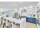 Spacious kitchen with an expansive island, stylish seating, and modern stainless steel appliances at 4880 Hayride St, Las Vegas, NV 89149