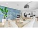 Open concept living room boasts modern decor, a cozy fireplace, and an open flow to the kitchen at 4880 Hayride St, Las Vegas, NV 89149