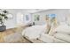 Spacious main bedroom with a seating area, bright windows, and an ensuite bathroom, designed for comfort at 4880 Hayride St, Las Vegas, NV 89149