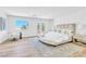 Bright main bedroom featuring a seating area, french doors, and a large window, creating a serene atmosphere at 4880 Hayride St, Las Vegas, NV 89149