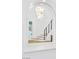 Bright foyer and staircase featuring modern chandelier and metal railing at 4880 Hayride St, Las Vegas, NV 89149