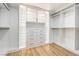 Bright walk-in closet with custom shelving, drawers, and storage cabinets at 4880 Hayride St, Las Vegas, NV 89149